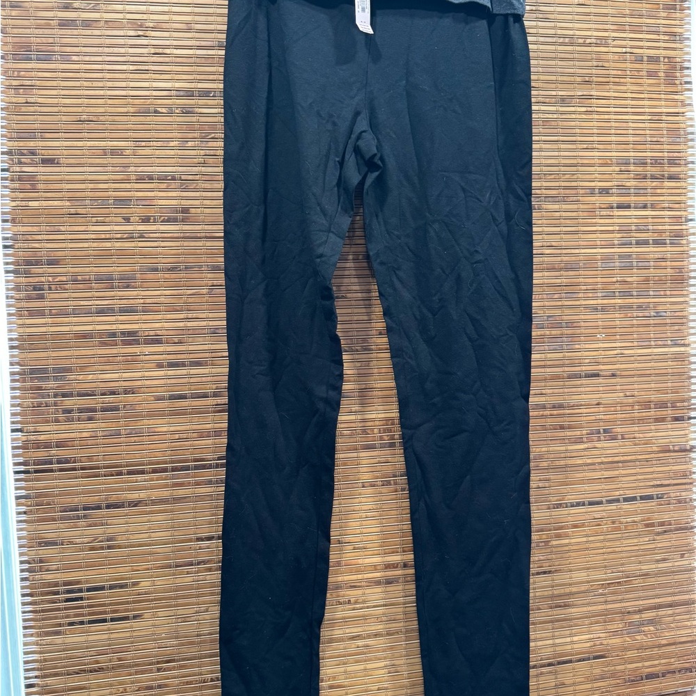 Black Dress Pants with a snug fit wide elastic waistband and smooth matte finish